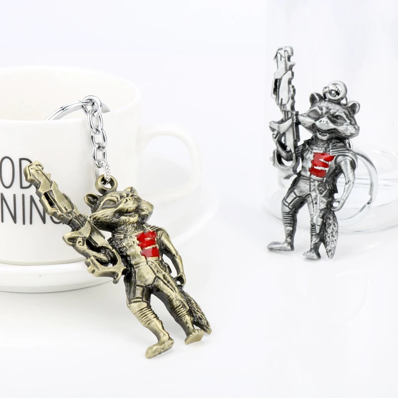Catoon Animal Raccoon Pendant Keychain Movie Theme Raccoon Holding Gun Shape Metal Alloy Keyring Jewelry Cosplay Props Gift