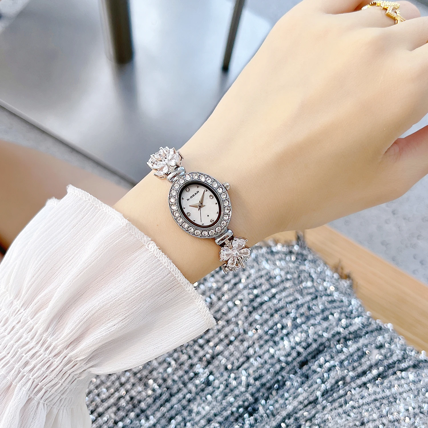 X-GEAR New Fashion Ellipse Ribbon-Strap Diamond-Studded Flower Watch Mother-of-Pearl for Women with Adjustable Bracelet