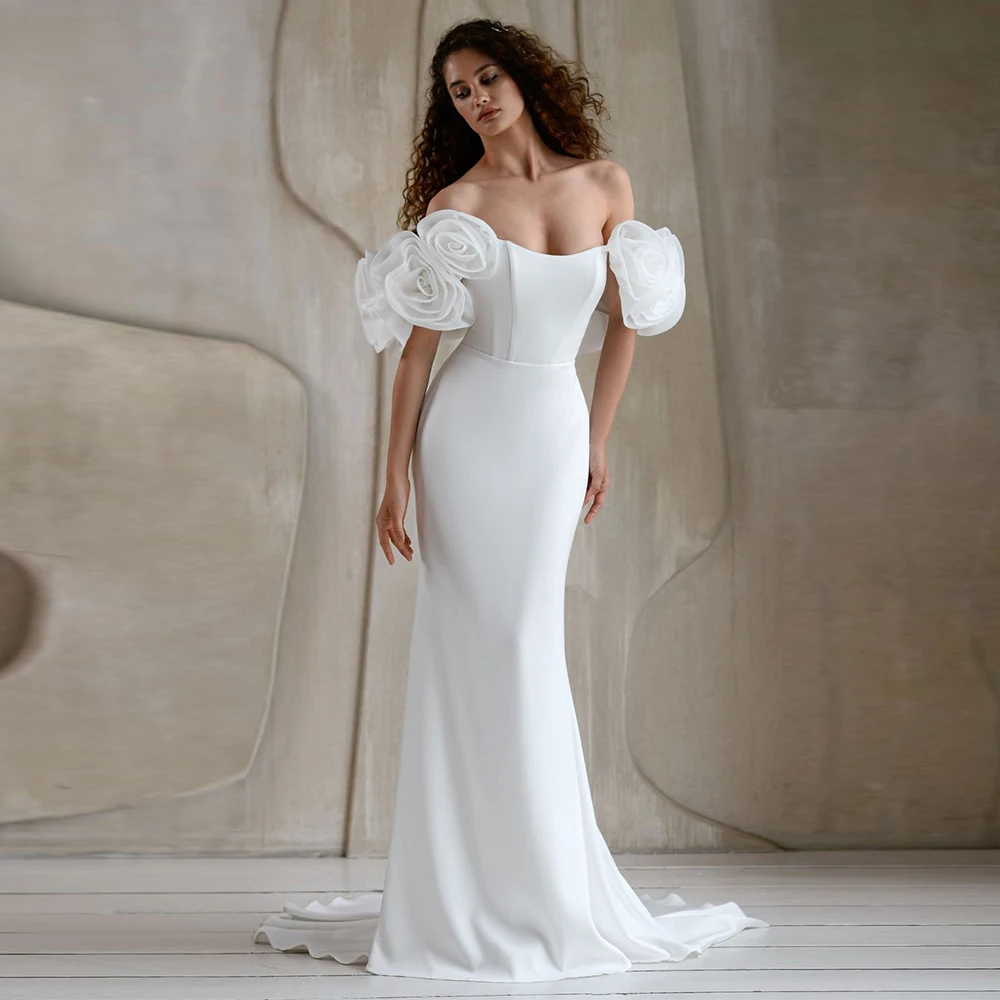 เทรนด์ชุดเดรสผู้หญิงสุดหรู ปี 2025 ชุดเดรสทรงเมอร์เมดผ้าเจอร์ซีย์สำหรับงานแต่งงาน งานเลี้ยง สีขาว เปิดไหล่ ประดับดอกไม้ 3 มิติ ชุดเดรสสำหรับงานแต่งงานในห้องโถง