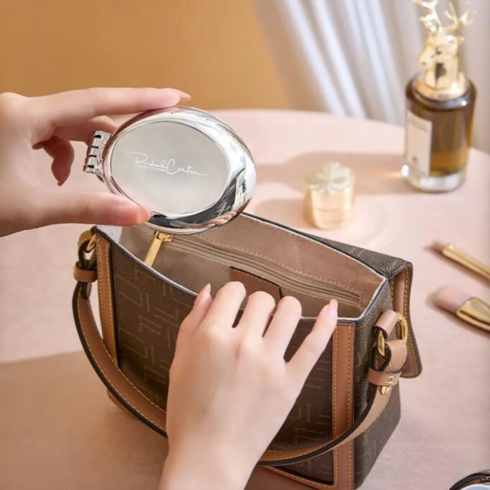 مرآة جيب مستديرة مع مشط مزدوج الاستخدام، فرشاة شعر تدليك فضية، مشط وسادة هوائية صغيرة قابلة للطي، مشط كيس هوائي