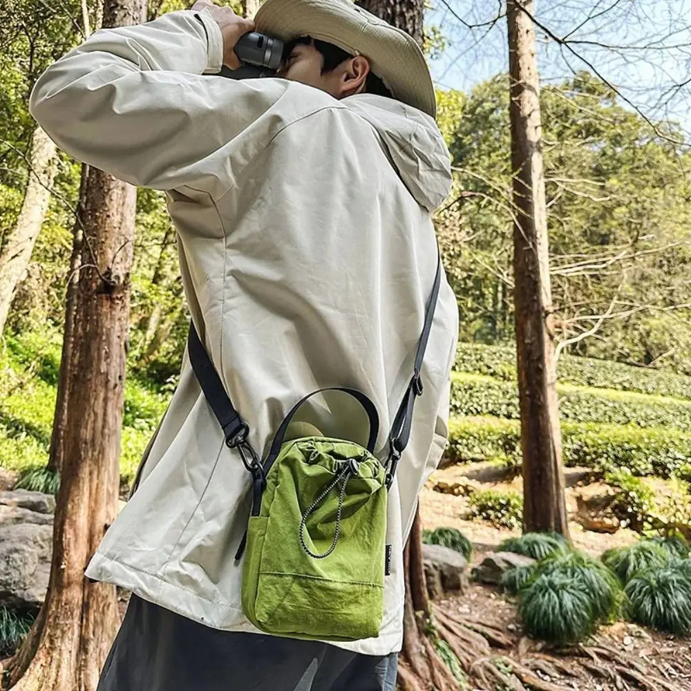 

Harajuku Sports Nylon Shoulder Bag Solid Color Casual Drawstring Crossbody Bag Coin Pouch Korean Style Mobile Phone Pack Travel