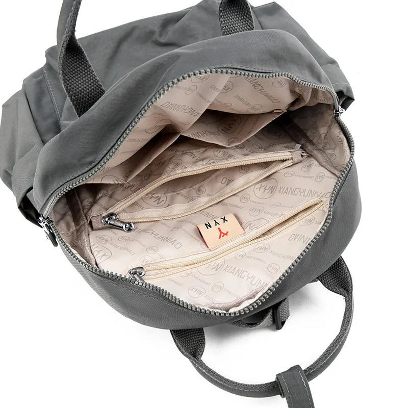 حقيبة ظهر كاجوال بسيطة للطلاب من Mochila ذات سعة كبيرة وجيوب متعددة مع حقيبة ظهر مناسبة للمدرسة الثانوية وحقائب الظهر للتنقل اليومي