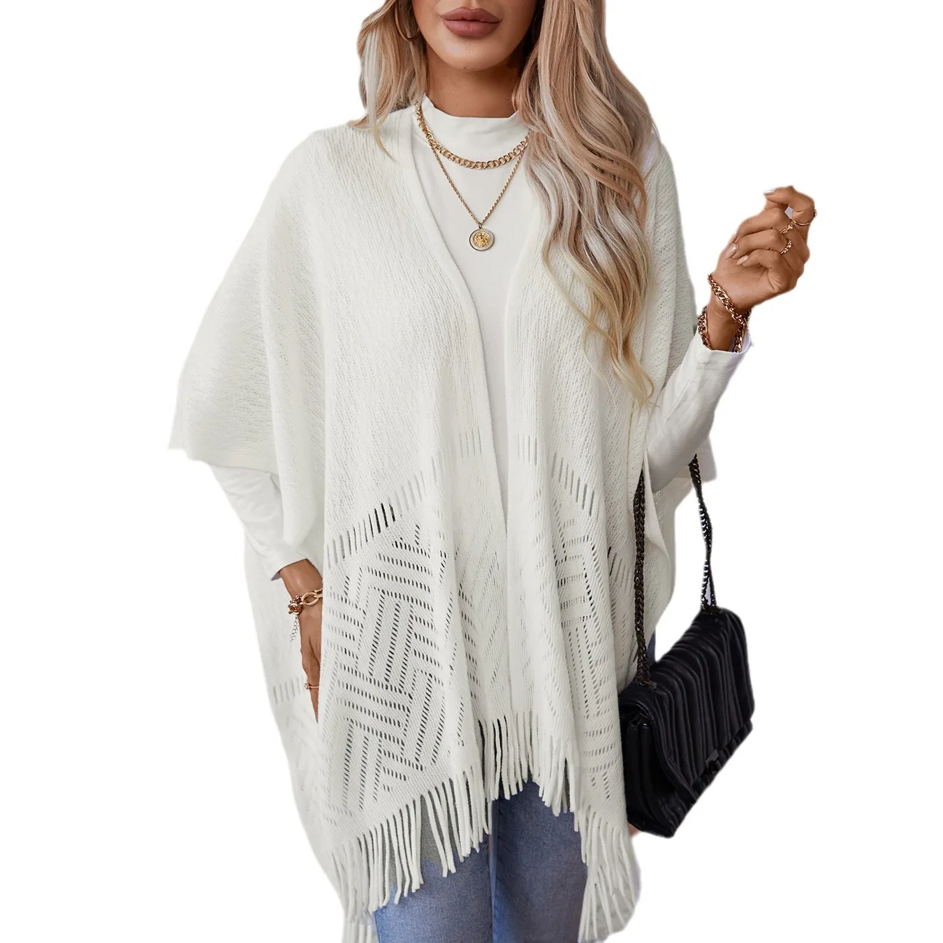 Solid color hollowed-out knitted fringed cape shawl women's autumn and winter new and American cross-border casual loose sweater