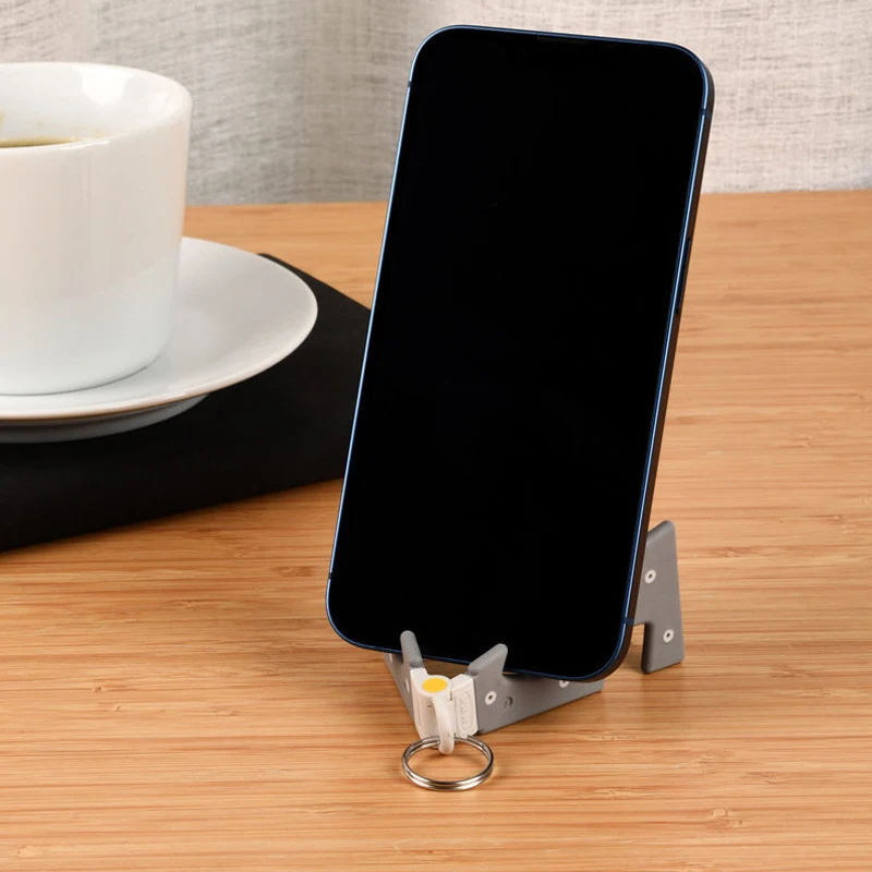Gantungan kunci ponsel meja portabel, gantungan kunci kreatif, dudukan ponsel sangat tipis dapat dilipat, mendukung ponsel