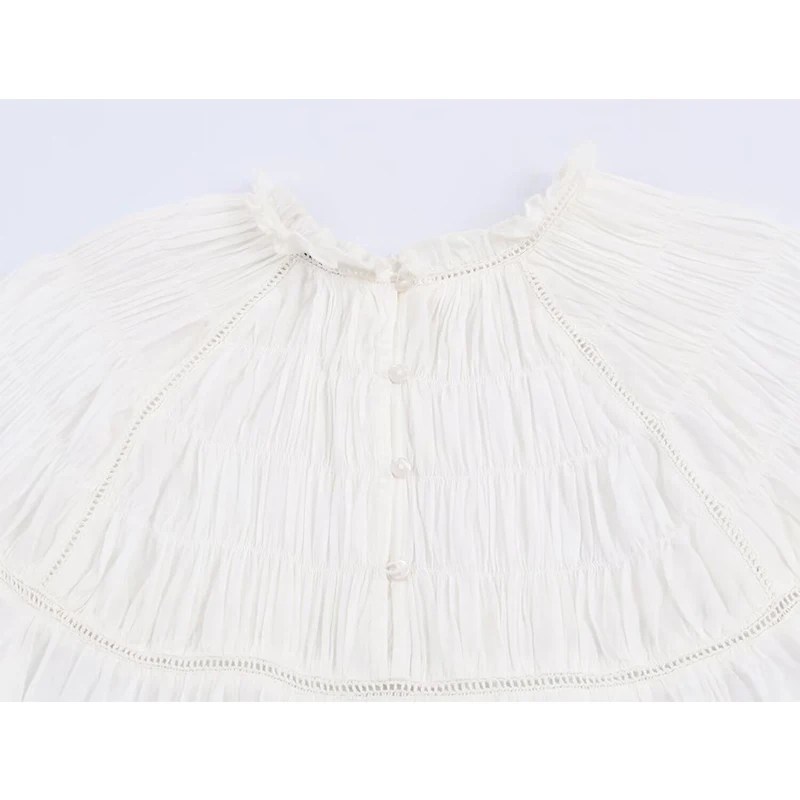 YENKYE بلوزة بيضاء رومانسية على شكل قرص العسل للنساء بأكمام واسعة ورقبة دائرية ملابس علوية غير رسمية لربيع 2026