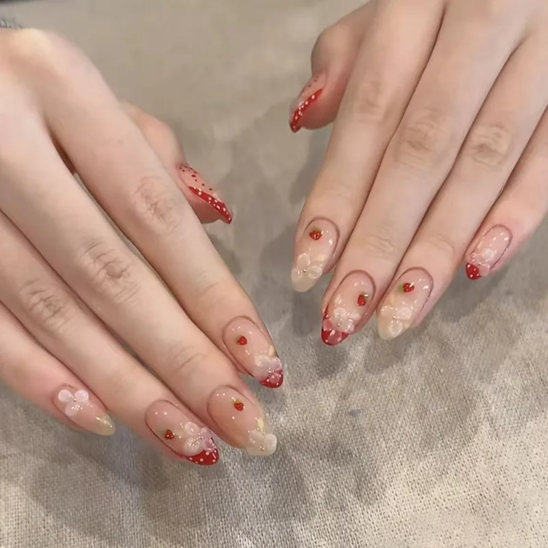 

24PCS Red Strawberry French Press on Nails with 3D White Flower Decor Nude Base Almond Shaped Acrylic False Nails for Sweet Wear