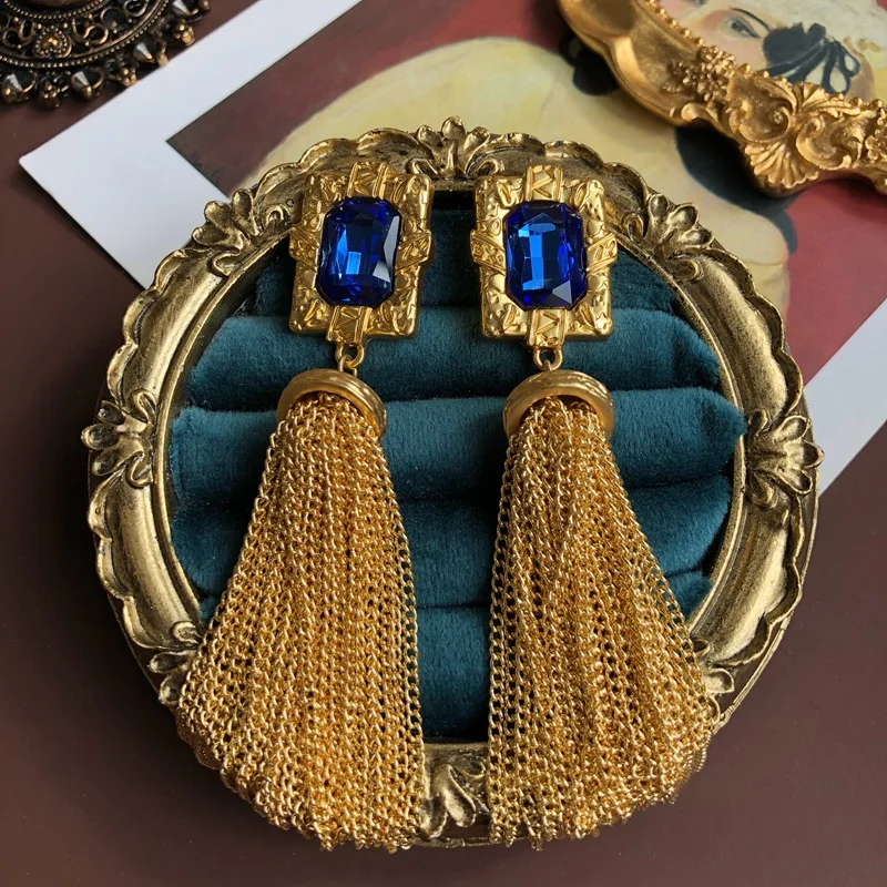 

Golden tassel chain, silver needle earrings, mysterious blue cut gemstone Shoulder sweeping pendant ear clip