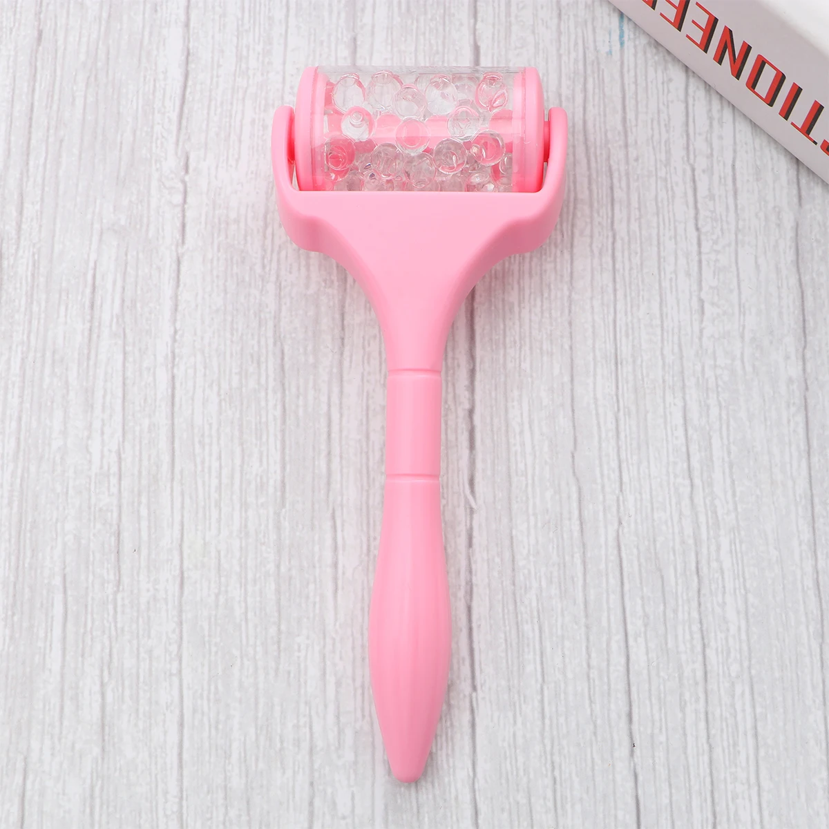 Masajeador Facial portátil, herramienta de elevación para el cuidado de la piel, rodillo Facial fino con mango rosa, cuentas transparentes, 1 ud.