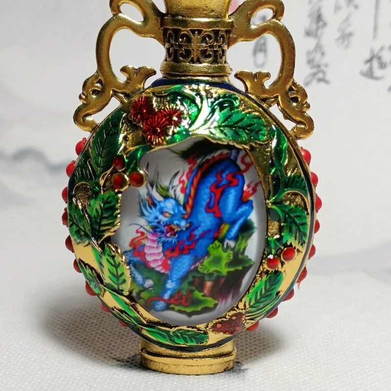 Antique-style Tibetan-inspired gemstone pendant featuring the mythical creature of the Nine Dragons playing with pearls, a vinta