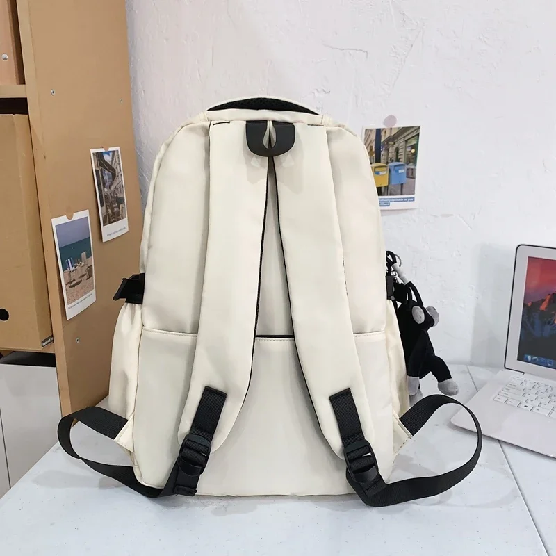 Bolsa escolar sólida de nylon à prova d'água com zíper de alta capacidade e bolsa de moedas mochila fashion 2025 venda quente novos sacos para meninas e meninos