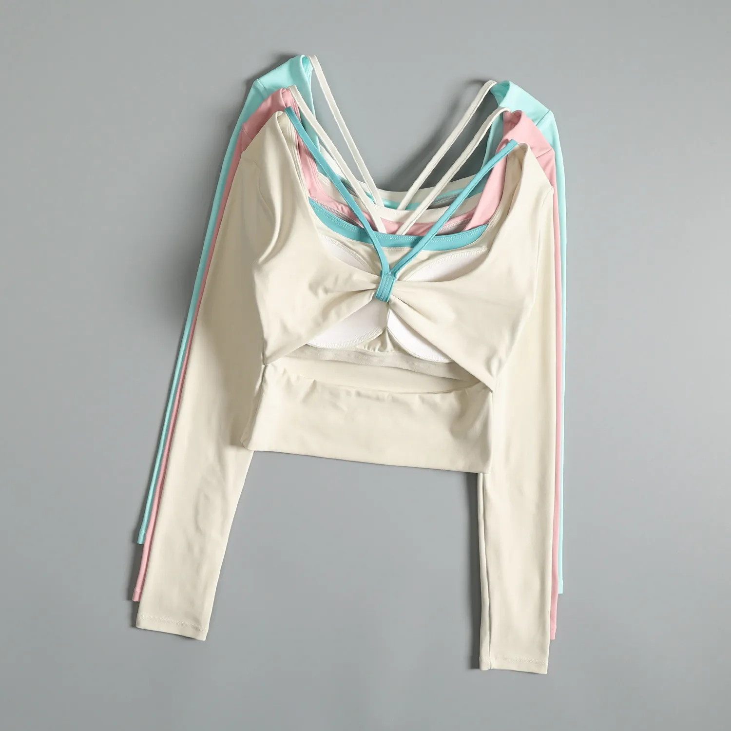 

High-end sports long-sleeved women's spring strap chest pad Pilates exercise yoga wear hollow beautiful back running fitness top