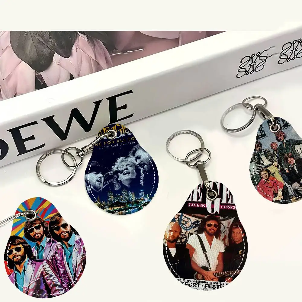 Bee Gees Band الرجال والنساء العالمي مانع االصدأ المفاتيح بولي Leather الجلود حامل بطاقة الوصول قطرة مفتاح العلامة الدائري