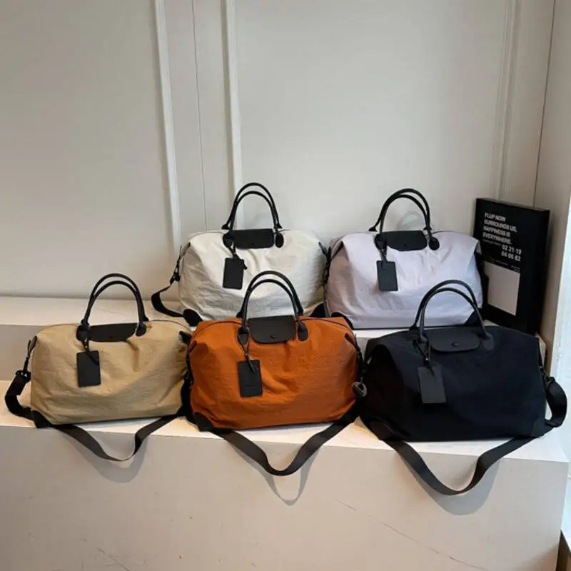 DuffleBag سعة كبيرة من النايلون المقاوم للماء مع حزام كتف من الجلد، أمتعة متينة لرحلة العمل وصالة الألعاب الرياضية والسفر #1