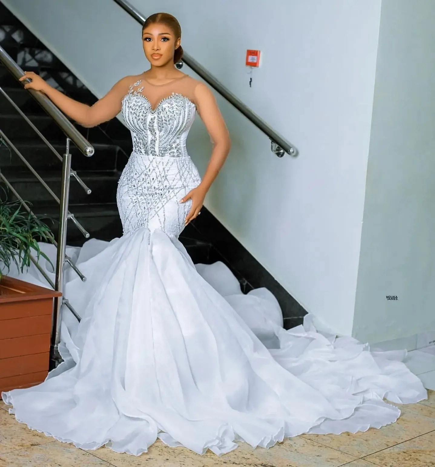 

New Modern Mermaid Wedding Dress 2026 Sheer O-neck Full Sleeves Crystals Beaded Organza Bridal Bride Gowns Robe De Mariage