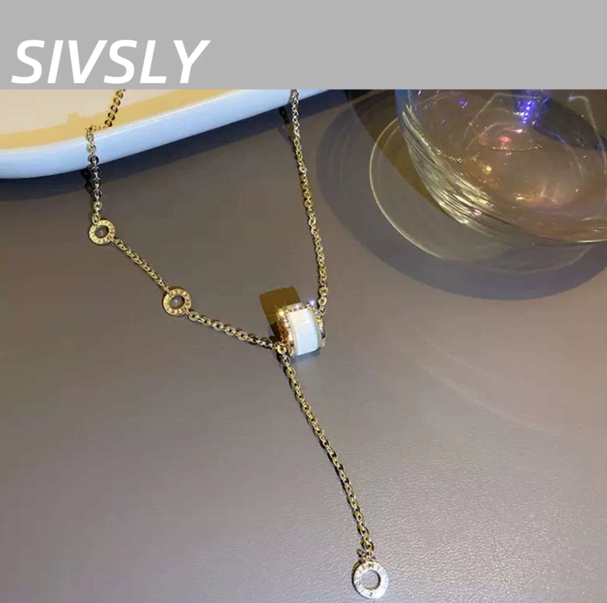 

Luxury design sense cat's eye stone round tube letter necklace ins style fashion temperament pendant internet celebrity retro