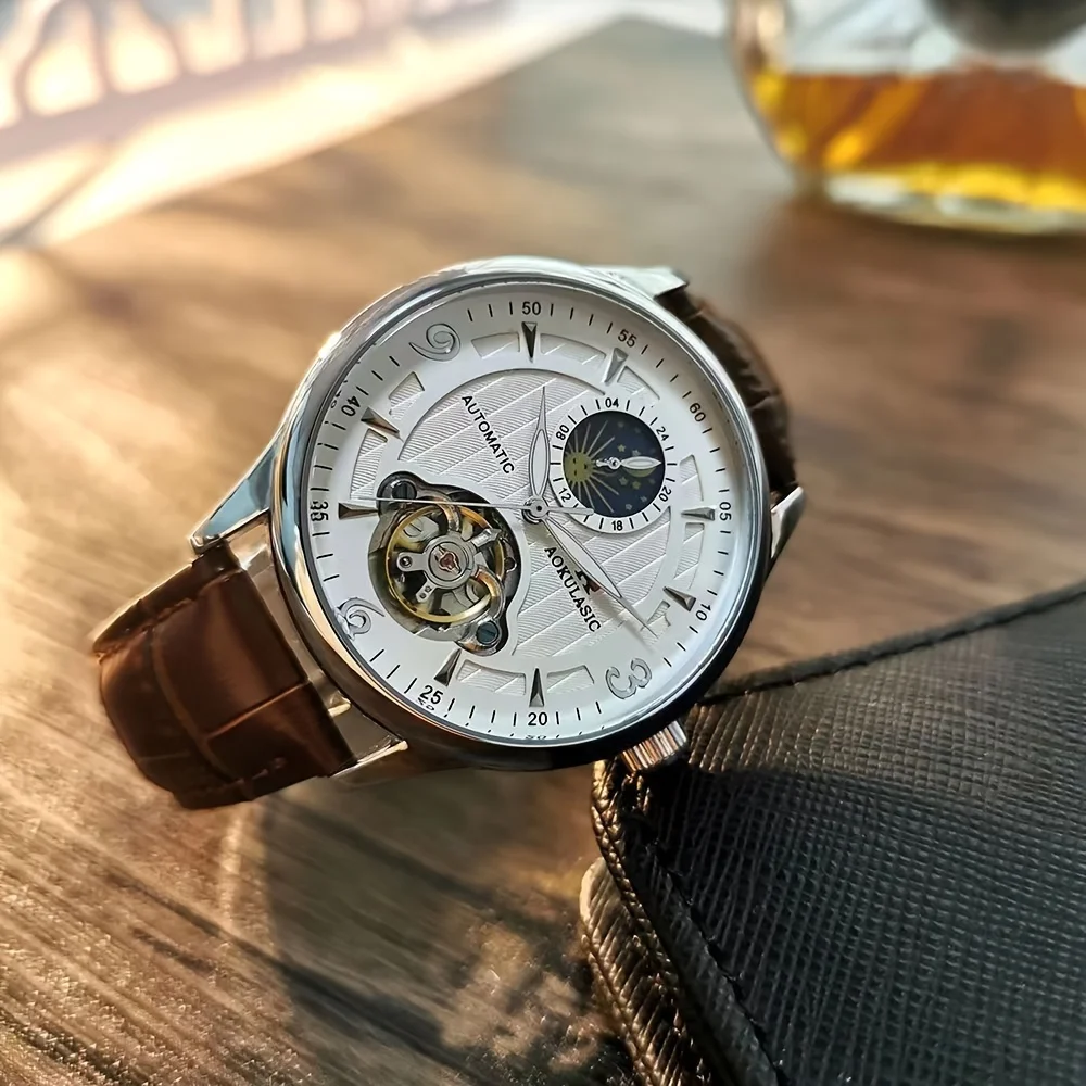 ساعة رجالية راقية بنمط عمل فاخر، تتميز بمينا هيكل عظمي، وهيكل معدني دائري، وحركة ميكانيكية أوتوماتيكية، وحزام جلدي، بدون بطارية، مثالية لعيد الحب، والكرنفال، وعيد الميلاد