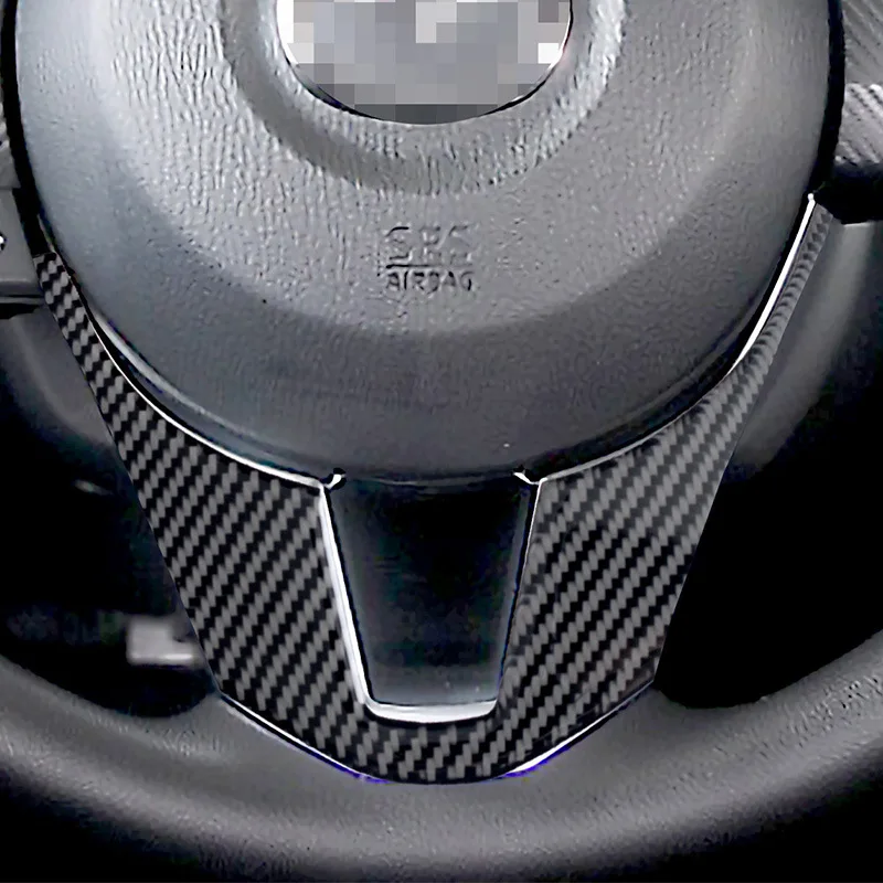 

Suitable for Mazda 3 Angsela interior modified real carbon fiber steering wheel chin decoration auto parts