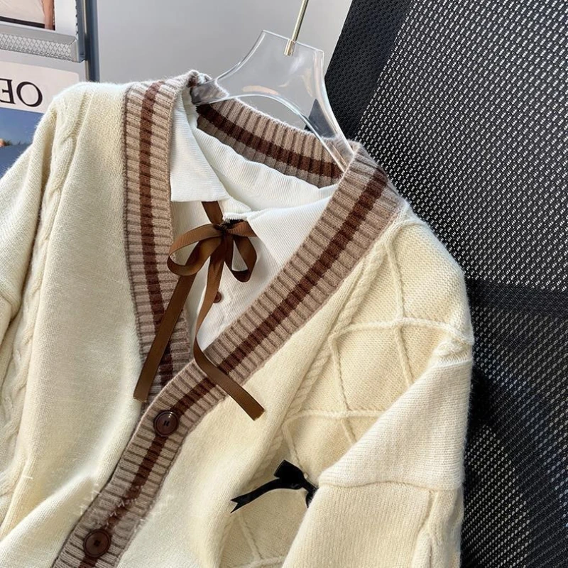 2025 Otoño/Invierno moda nueva mujer elegante tejido dulce estilo universitario chica tejido manga larga diseño de lazo cárdigan de lana