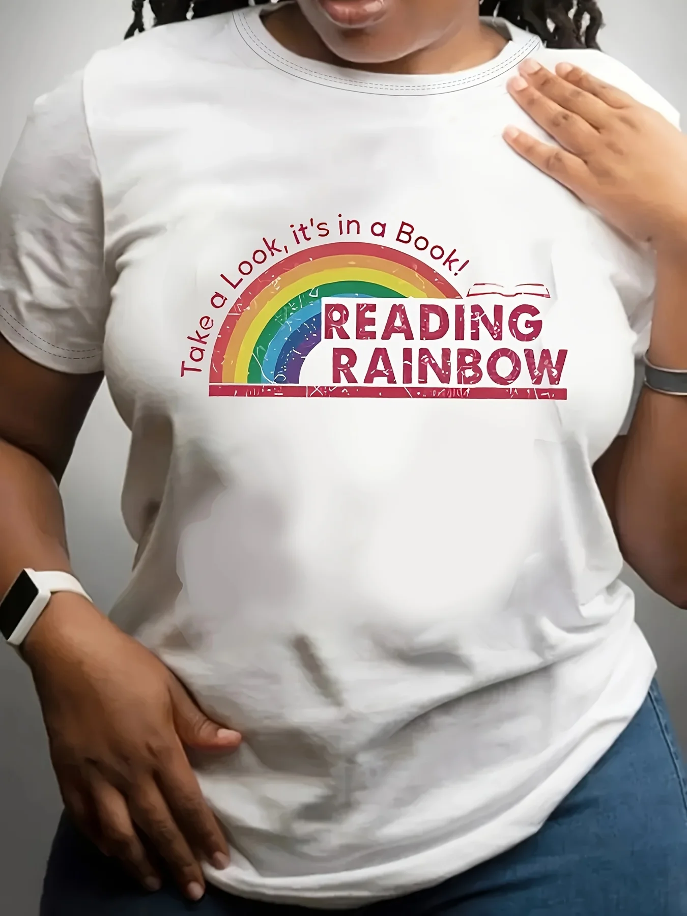 

Plus Size Women's "Take a Look It's a Book Reading Rainbow" Graphic T-Shirt - White Short Sleeve Round Neck Casual Top