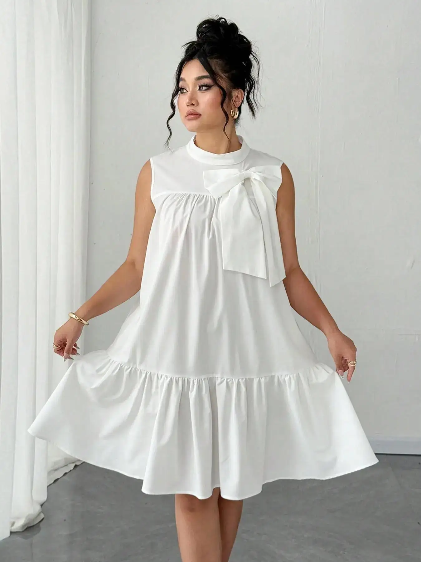 

Plus-size women's casual loose sleeveless dress with bow tie collar design for summer fashion and versatile use