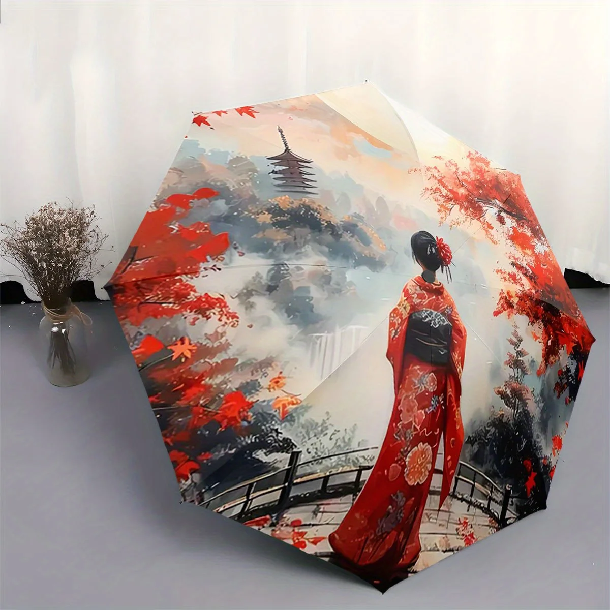 

Automatic Folding Umbrella A woman in a red kimono stands on a bridge under red autumn leaves with a pagoda in the background.