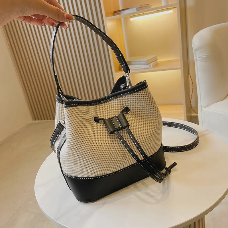 New canvas contrast color portable bucket bag Street trend texture drawstring One Shoulder Messenger canvas bag