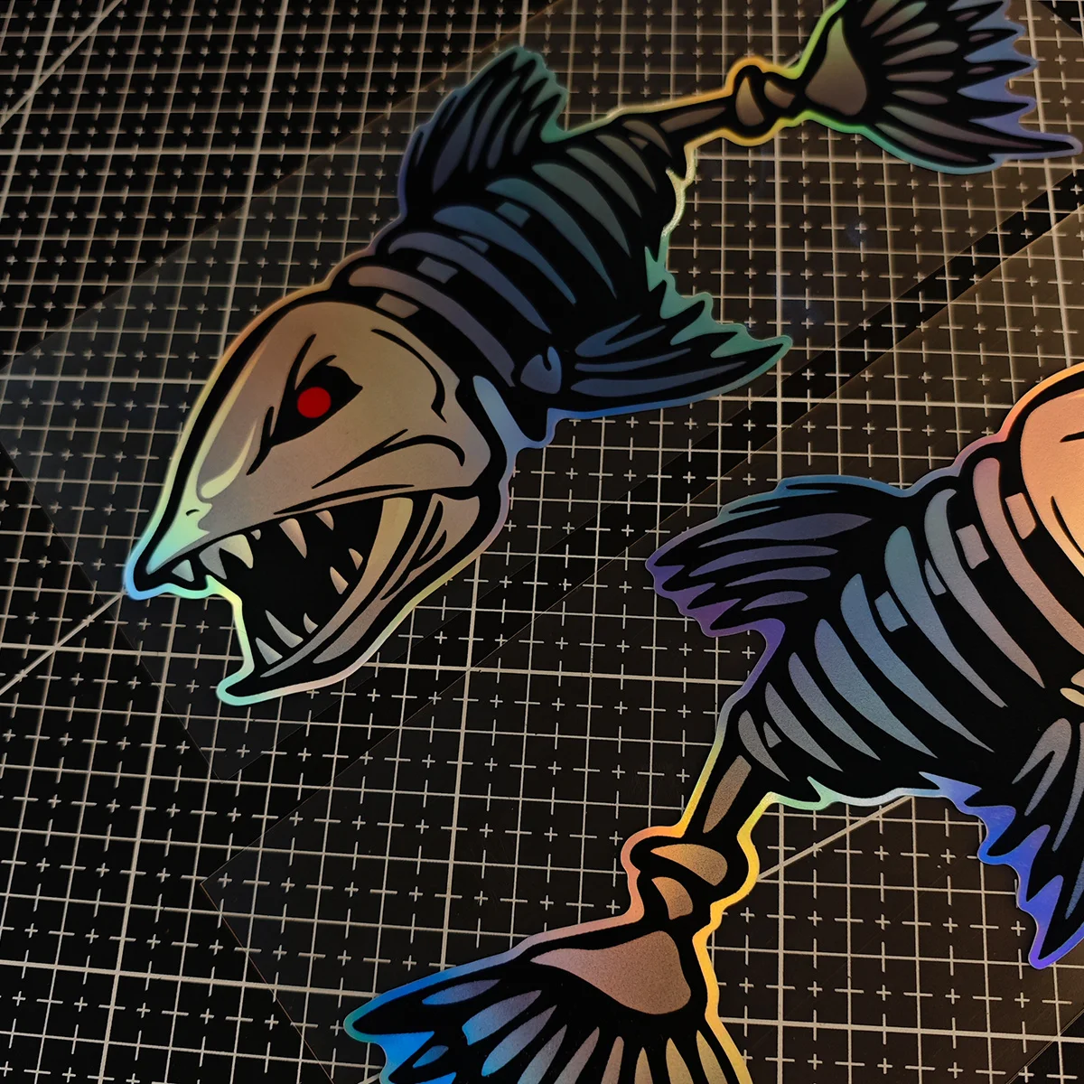 Two laser fishbone stickers, designed with a cartoon animation theme, are made of vinyl and have a matte finish.