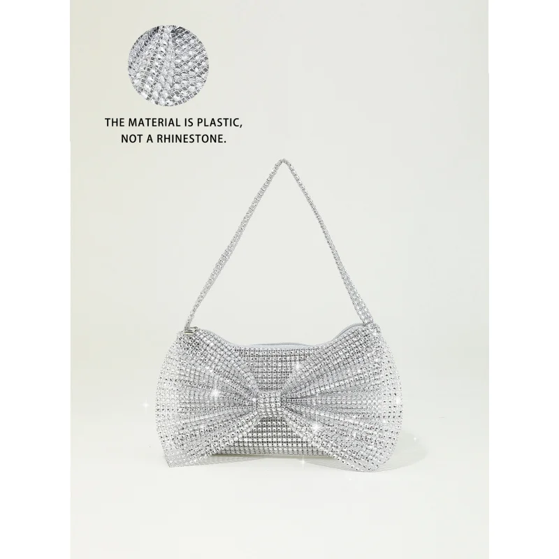 

New shiny glittering rhinestone-embellished bow decoration with unique designminiHandheld party evening bag