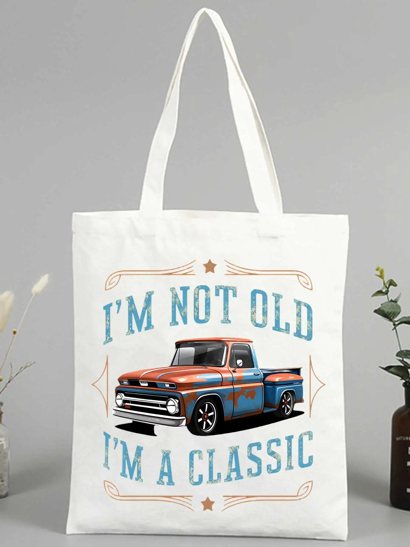 Vintage car graphic canvas tote bag with slogan-style print, perfect for casual shopping and daily outings