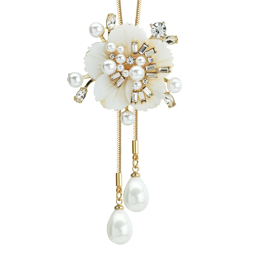 

A fashionable, luxurious and multi-functional necklace with a double floral pendant sweater chain brooch