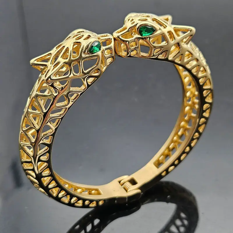 

Stainless steel hip hop hollow two-headed leopard green eye elastic bracelet