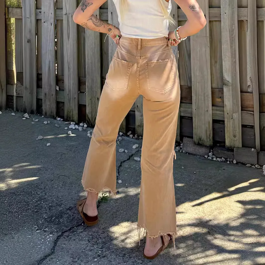 Damskie podarte jeansy casualowe, obcisłe, elastyczne, z guzikami, kieszeniami i modelującym krojem.