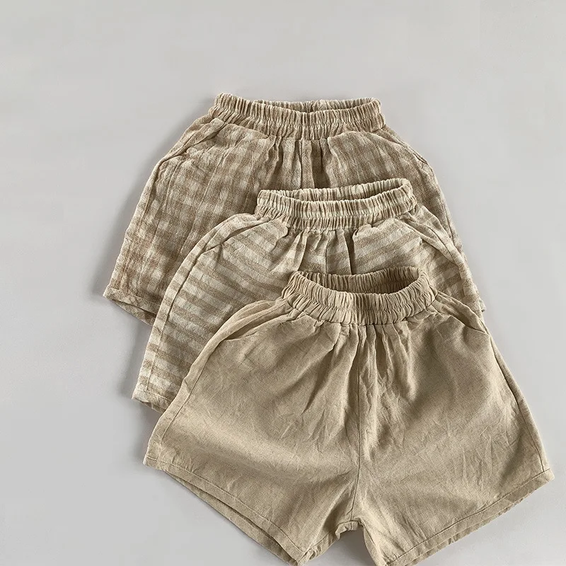 Ropa de estilo coreano para niños pequeños, pantalones cortos sueltos de verano 2025, pantalones a rayas a cuadros para niños