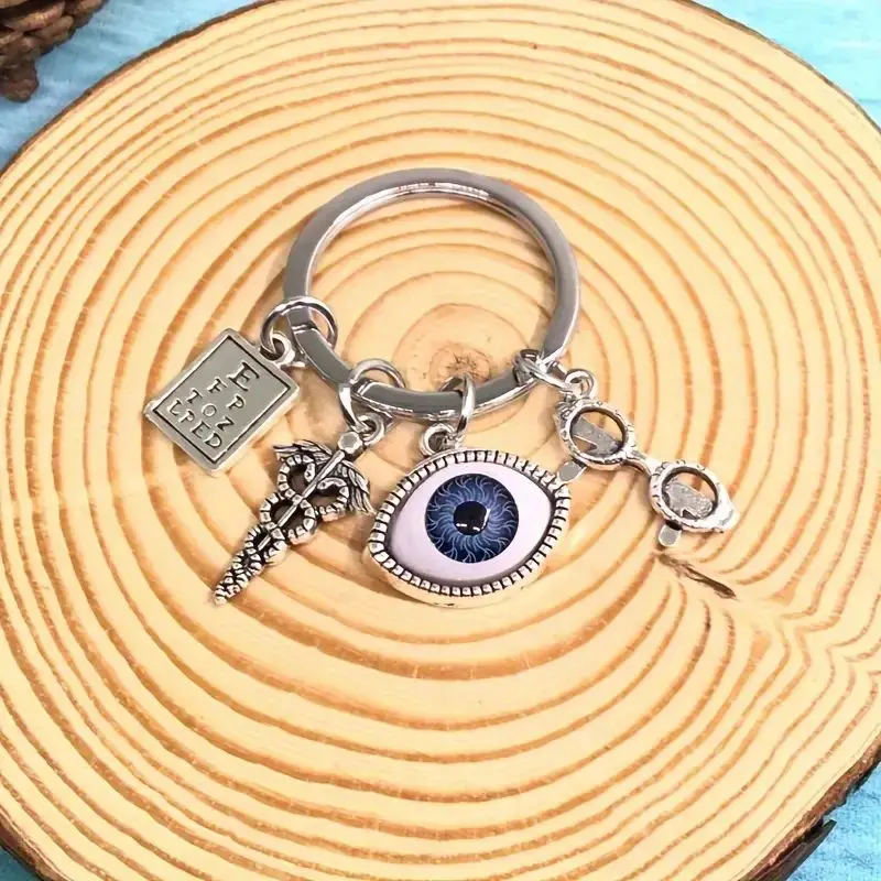 Silvery Charm Keychain With Eye Design, Optometry Themed Keyring With Charms, Unique Accessory For Bags And Keys