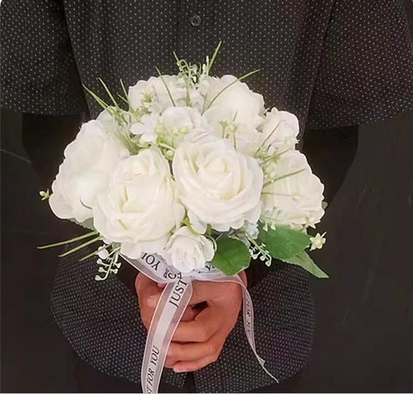 

White background wall rose holding flowers photo studio bride theme photo personality fashion artificial flower photography.