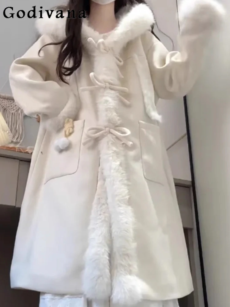 معطف نسائي موضة حلوة متعدد الاستخدامات بفيونكة لتقليل العمر بلون واحد لشتاء 2025 معاطف صوفية كورية فضفاضة طويلة لطيفة بقلنسوة #1