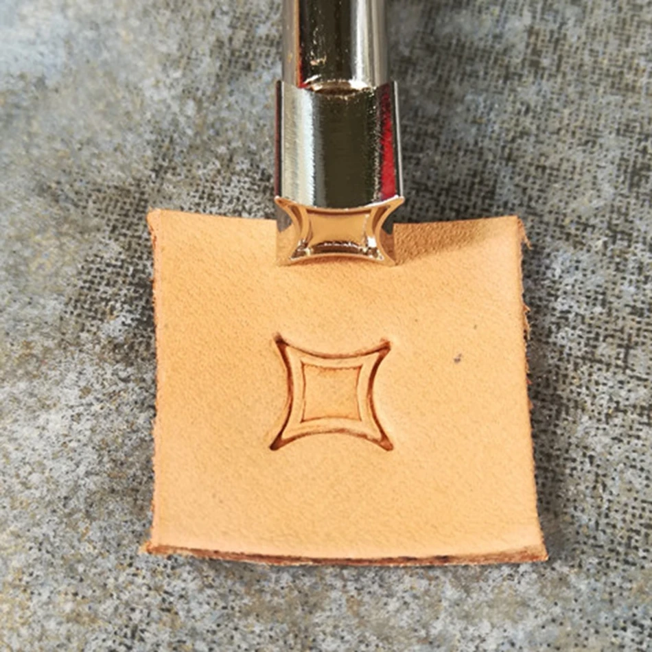 Leathercraft tools and hardware, precision steel engraving and embossing tools, geometric four-point star decorative patterns.