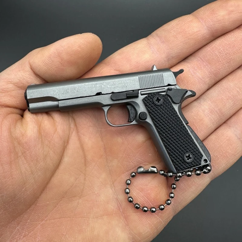 1:3 معدن الذهب M1911 كولت مسدس لعبة نموذج الاصطناعي بندقية صغيرة سبيكة المفاتيح نظرة مجموعة حقيقية الدعامة عيد ميلاد معلقة هدية الصبي #4