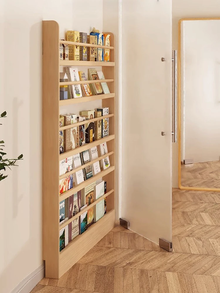 The ultra-thin bookshelf behind the door is integrated with a wall mounted multi-layer storage rack