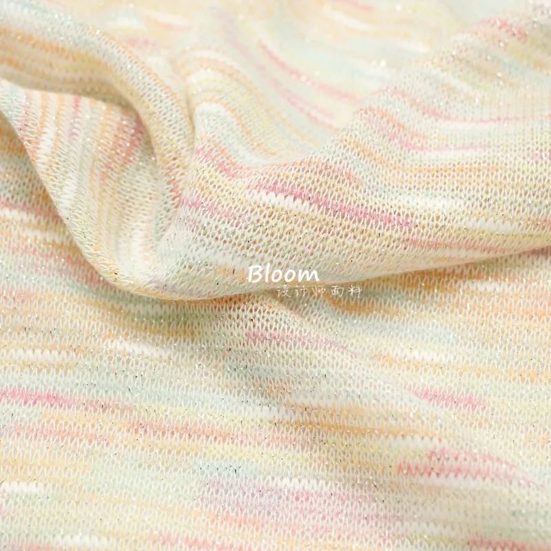 

1 метр тонкой, мягкой и эластичной переливающейся розово-голубой ткани с серебряной нитью, связанной крючком.