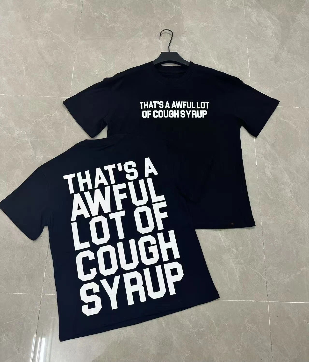 That was a large quantity of cough syrup short-sleeved American streetwear hip-hop cartoon cough syrup T-shirts.