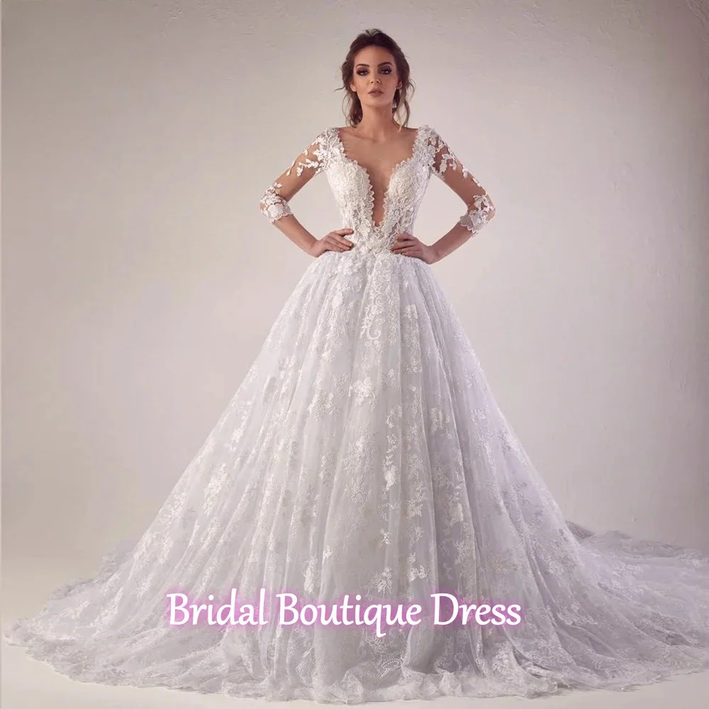 Abiti da sposa personalizzati squisiti con abito da ballo in pizzo a linea A per la sposa Abiti da sposa africani da giardino a maniche lunghe con collo trasparente