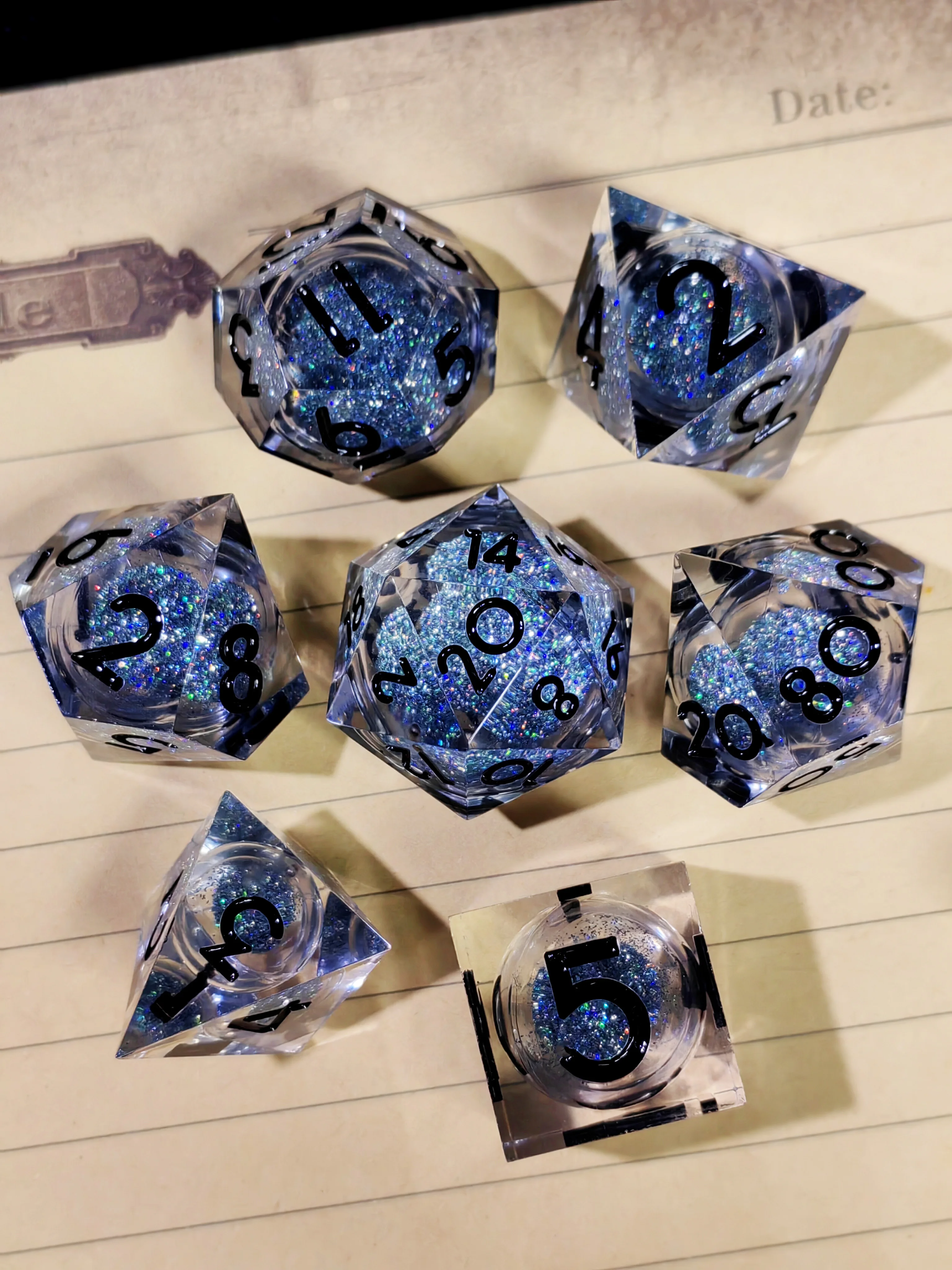 

DnD Dice Set – 7 Piece Sharp Edge Resin Dice, Silver Sand, Transparent Base, Black Numbers, for Dungeons & Dragons, RPG