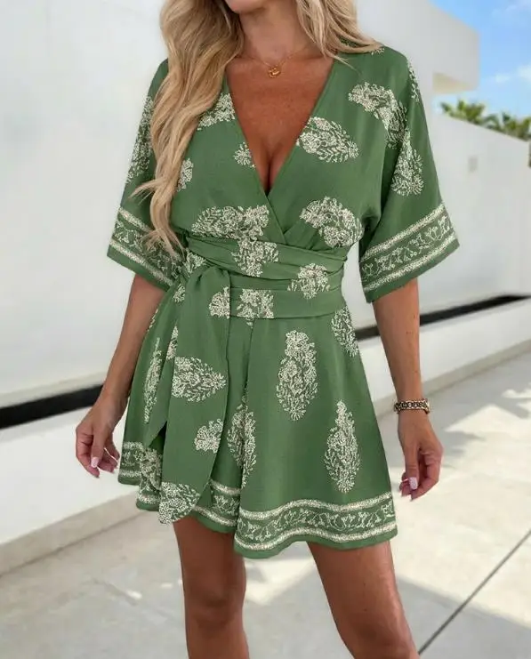 

Женский комбинезон 2026: Новинка Весна-Лето, Модный винтажный принт с растениями, с перекрывающимся дизайном, глубоким V-образным вырезом, завязками на талии, коротким рукавом, в стиле бохо