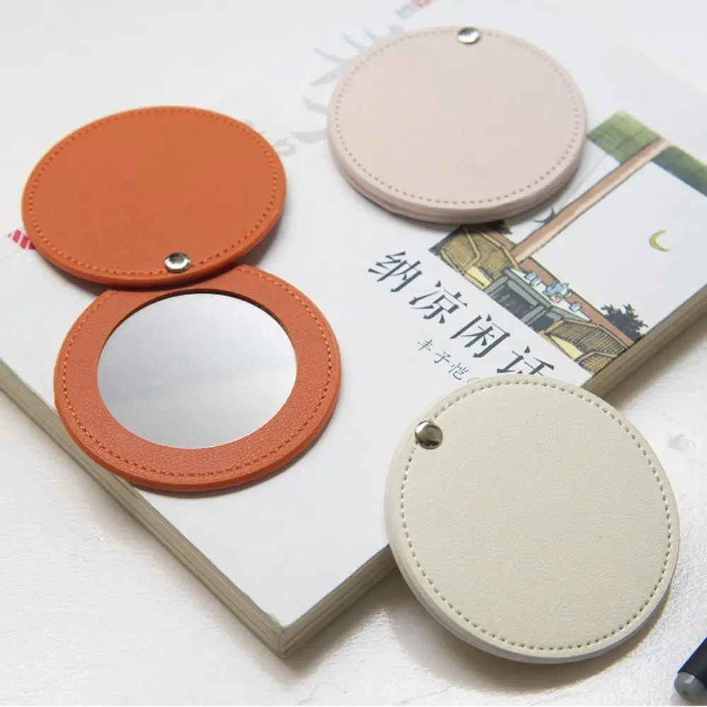 Nuovo specchio per il trucco in pelle PU Specchio cosmetico rotondo ultrasottile Specchio tascabile leggero in tinta unita