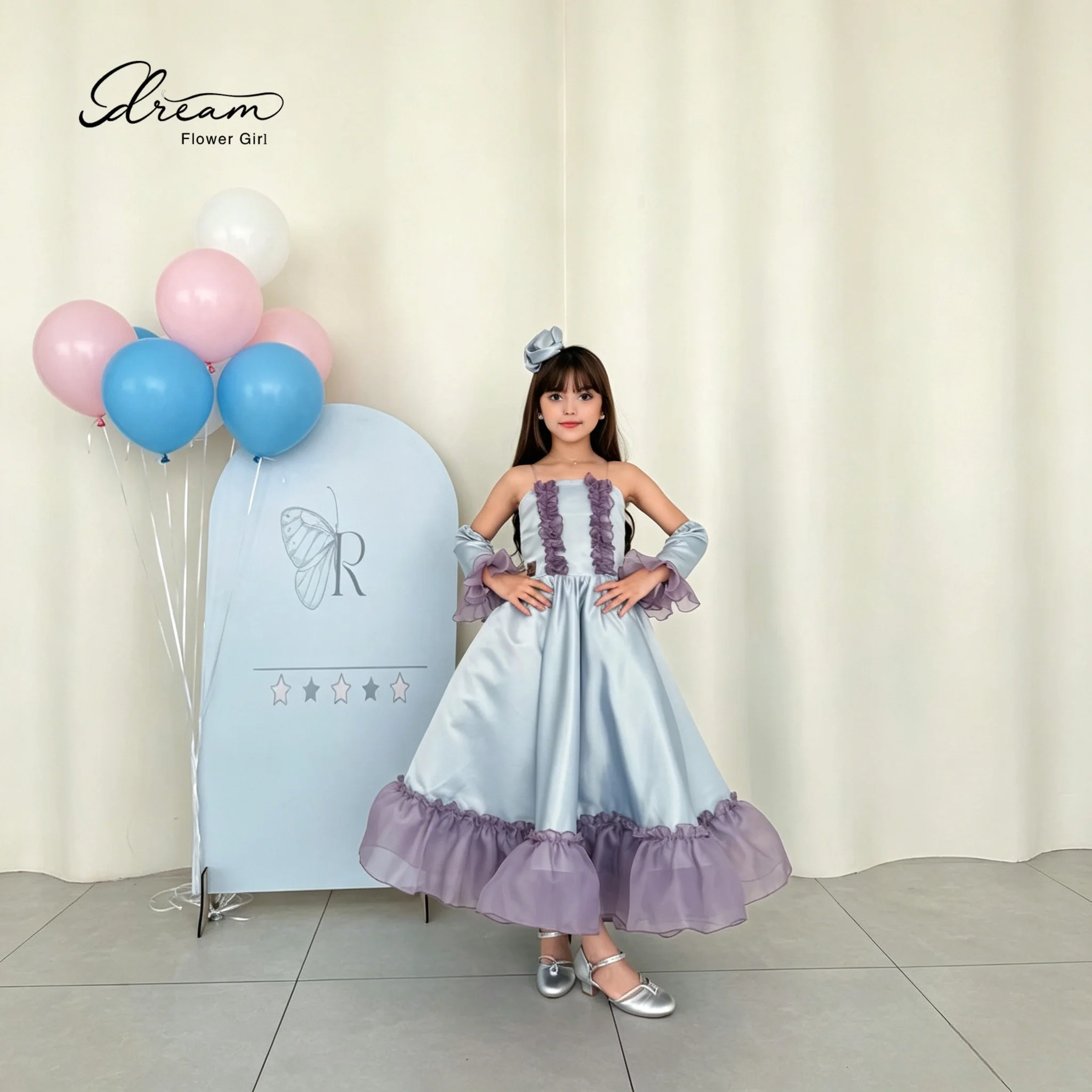 An elegant young lady's strapless formal ball gown, with a fluffy skirt and decorated with purple bows.
