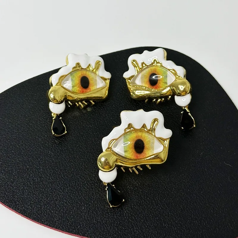 

Demon Eyes Exaggerated art eyes Black teardrop asymmetrical earrings, rings, stars with surreal design face series