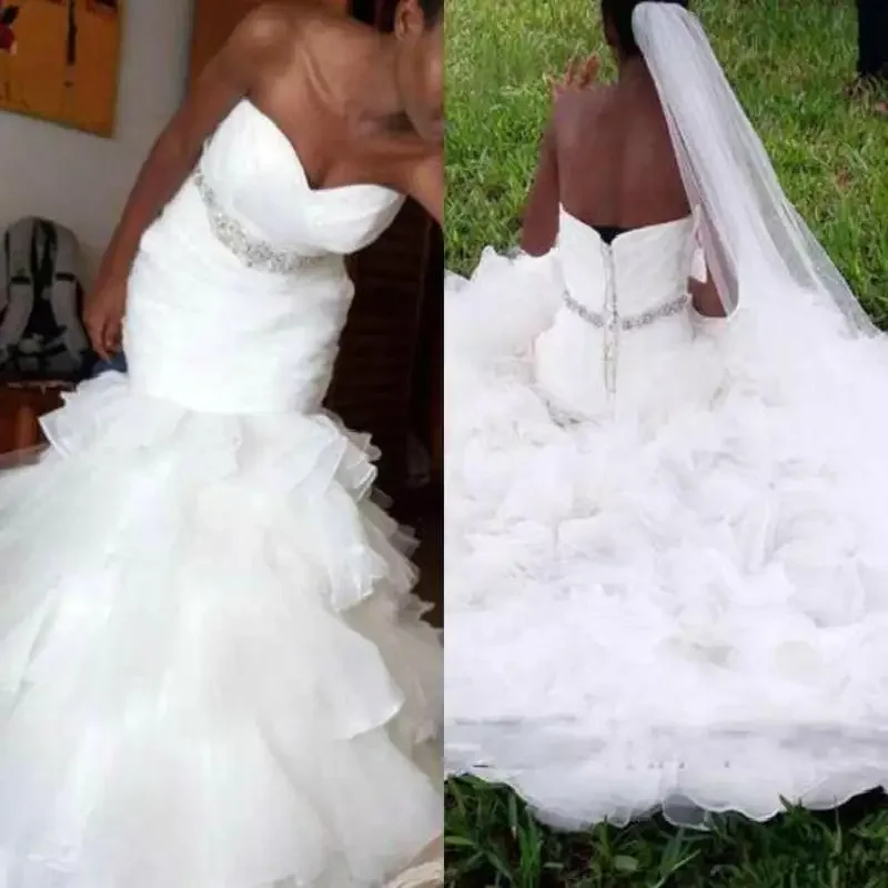 

Customized African White Plus Size Mermaid Wedding Dresses Sweetheart Pleat Tiered Ruffles Crystal Sash Trumpet Bridal Gowns