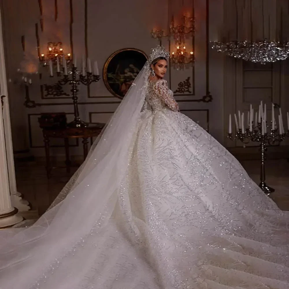 ชุดแต่งงานแบบบอลกาวน์สั่งตัดพิเศษ ประดับด้วยเลื่อมระยิบระยับ แขนยาว แต่งลูกไม้ ประดับลูกปัด สไตล์เจ้าหญิง วิบวับ