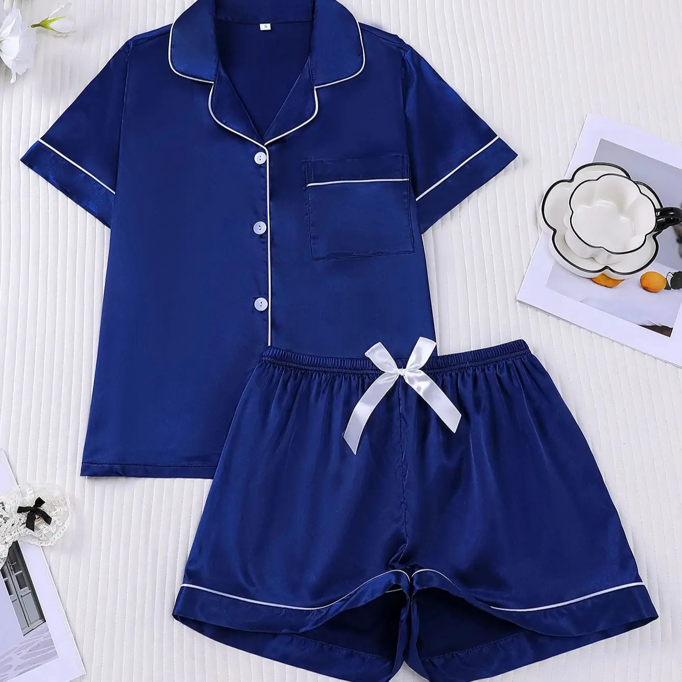 

Women's black imitation silk lapel short sleeved bow shorts set with contrasting colors and edging can be worn as outerwear